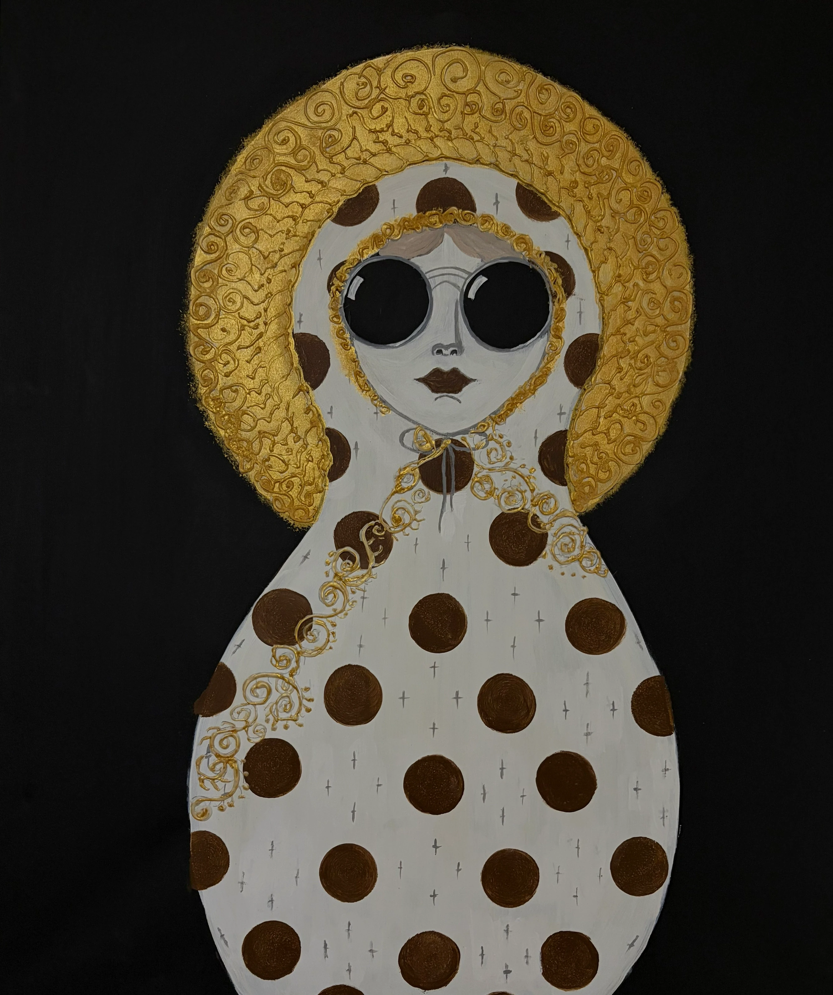 A figure with dark round glasses, a gold headdress and a pale garment with brown dots.